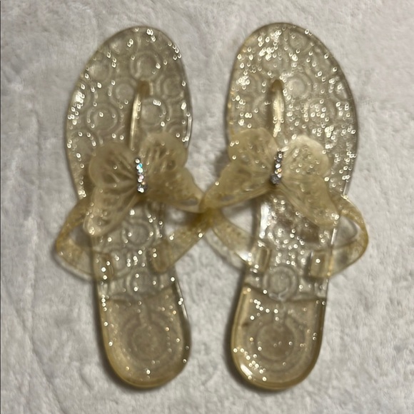 Coach Shoes - COACH. Gold Glitter Jelly Sandals with Butterfly and Rhinestones. Size 8. NWOT.